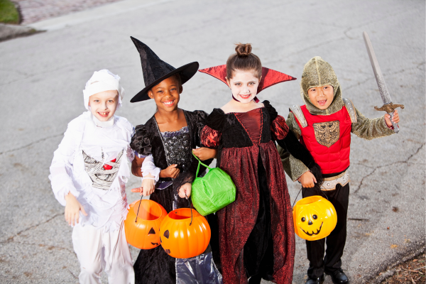 Young children are following Halloween safety tips when out trick or treating. 