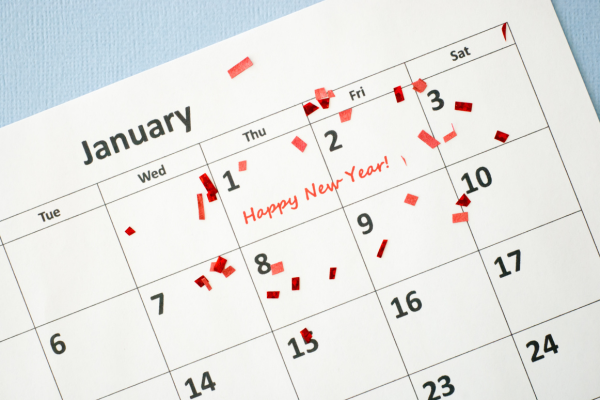 A calendar marks January 1 and Happy New Year