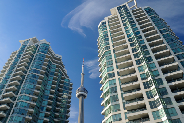 Toronto's famous CN Tower sits between two condo buildings. Condos in the Toronto rental market are becoming more affordable.
