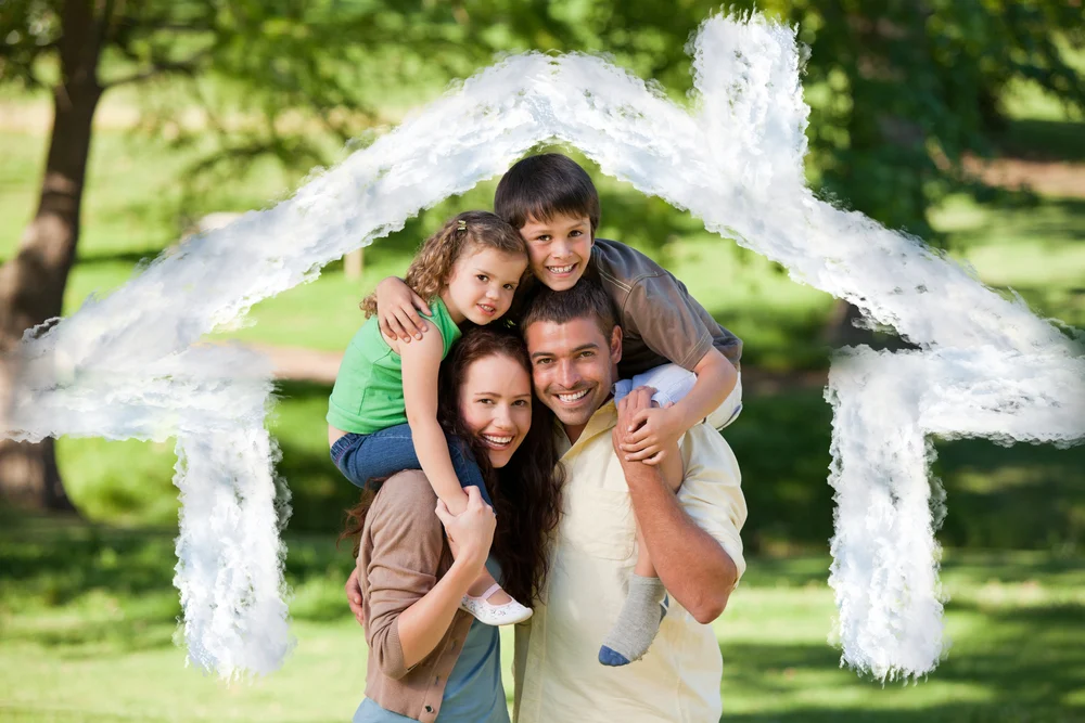 happy family under a cloud design of a house. 